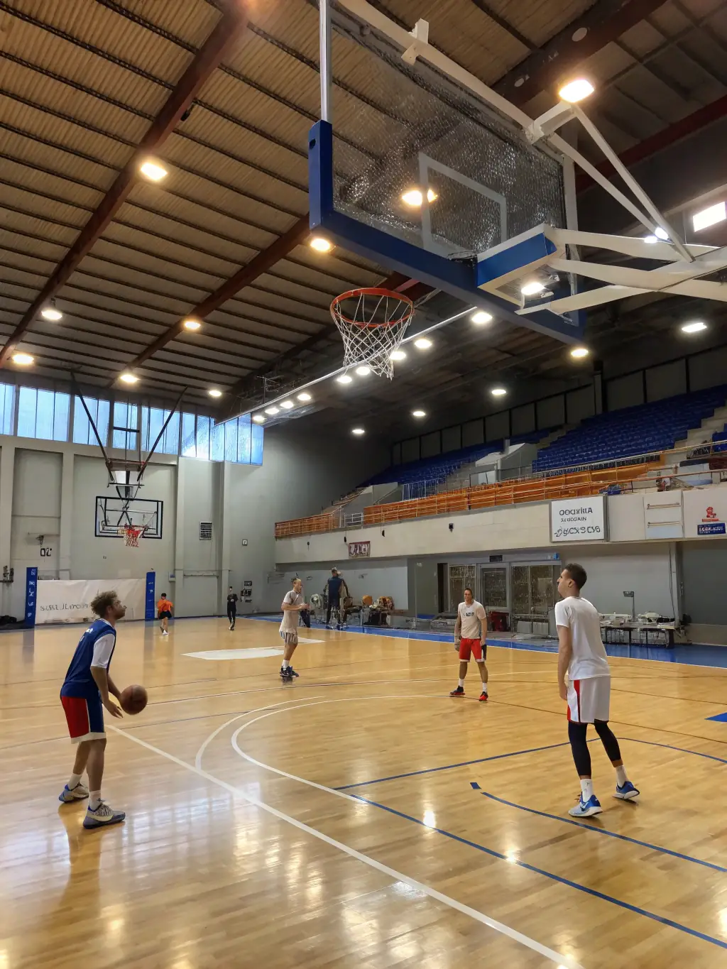 A dynamic image of adults participating in a basketball training session at ASSOCIATION SPORTIVE DU RIPAULT, emphasizing fitness and competitive spirit.